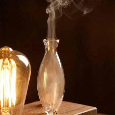 Detail: mist rising from the glass vessel